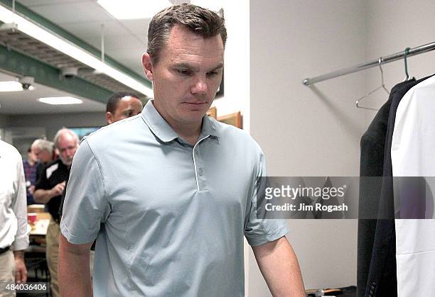 Ben Cherington, general manager of the Boston Red Sox, leaves the pressroom after addressing the media before a game with the Seattle Mariners at...