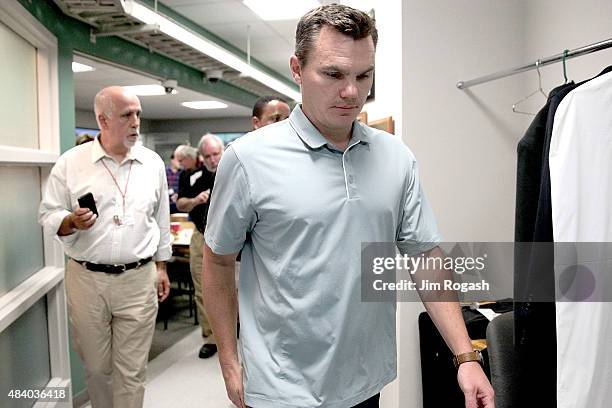 Ben Cherington, general manager of the Boston Red Sox, leaves the pressroom after addressing the media before a game with the Seattle Mariners at...