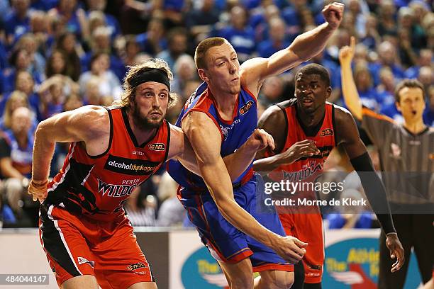Jesse Wagstaff of the wildcats competes with Mitch Creek of the 36ers during game two of the NBL Grand Final series between the Adelaide 36ers and...