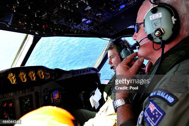 Royal New Zealand Air Force Co Pilot squadron Leader Brett McKenzie and Flight Engineer Trent Wyatt sit in the cockpit aboard a P3 Orion maratime...