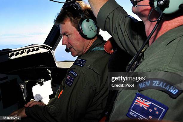 Royal New Zealand Air Force Co Pilot squadron Leader Brett McKenzie and Flight Engineer Trent Wyatt sit in the cockpit aboard a P3 Orion maratime...