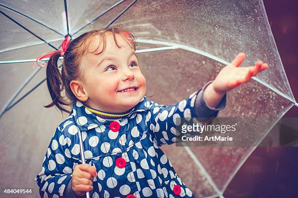 happy in rain - caught in rain stock pictures, royalty-free photos & images