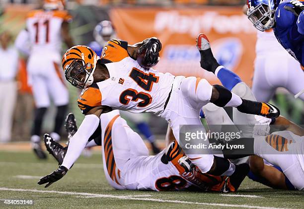 James Wilder Jr of the Cincinnati Bengals runs with the ball against the New York Giants during an preseason game at Paul Brown Stadium on August 14,...