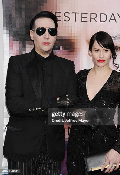 Musician Marilyn Manson and Lindsay Usich arrive at the 'Transcendence' - Los Angeles Premiere at Regency Village Theatre on April 10, 2014 in...