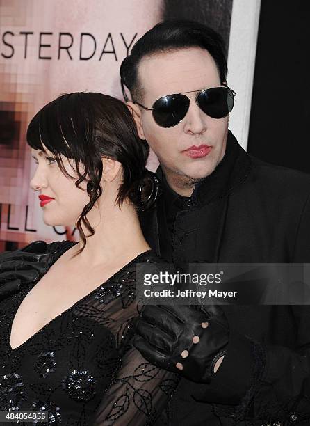 Musician Marilyn Manson and Lindsay Usich arrive at the 'Transcendence' - Los Angeles Premiere at Regency Village Theatre on April 10, 2014 in...