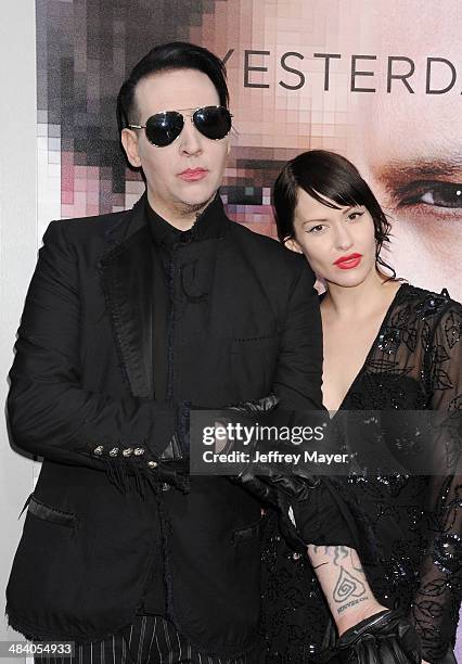 Musician Marilyn Manson and Lindsay Usich arrive at the 'Transcendence' - Los Angeles Premiere at Regency Village Theatre on April 10, 2014 in...