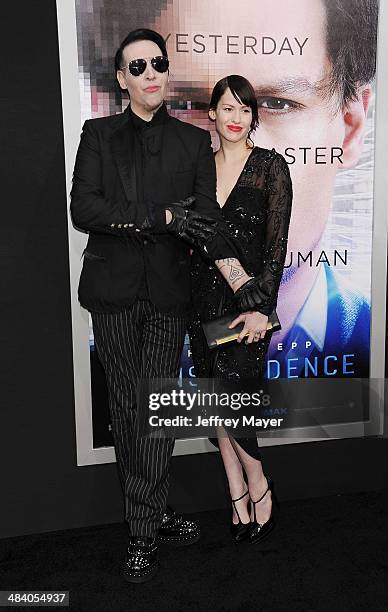 Musician Marilyn Manson and Lindsay Usich arrive at the 'Transcendence' - Los Angeles Premiere at Regency Village Theatre on April 10, 2014 in...