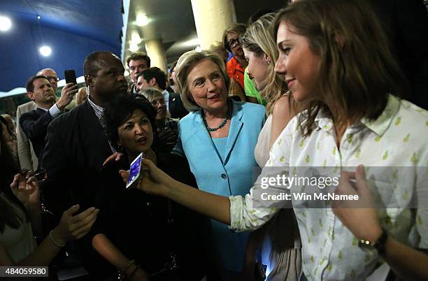 Democratic presidential candidate Hillary Clinton greets supporters in the audience after speaking at the Iowa Democratic Wing Ding August 14, 2015...