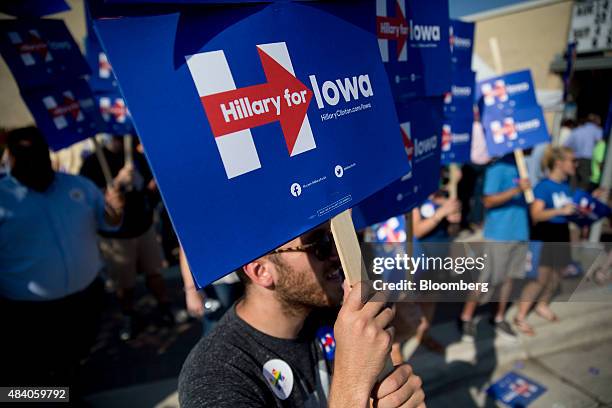 Supporter of Hillary Clinton, former U.S. Secretary of state and 2016 Democratic presidential candidate, holds a campaign sign during a rally outside...