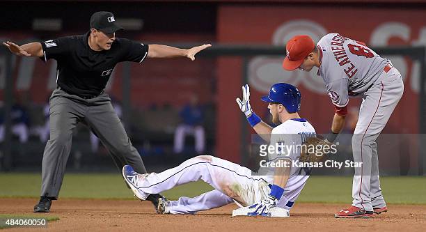Kansas City Royals' Ben Zobrist is safe at second before the tag from Los Angeles Angels shortstop Taylor Featherston in the sixth inning during...