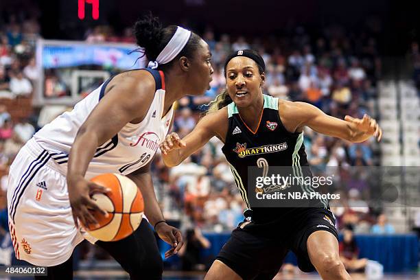 Candice Wiggins of the New York Liberty defends Chelsea Gray of the Connecticut Sun on August 14, 2015 at the Mohegan Sun Arena in Uncasville,...