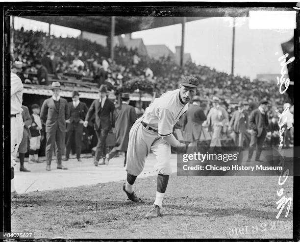 National League's Chicago Cubs baseball player McConnell throwing a ball on the field at Weeghman Park, Chicago, Illinois, 1916. Weeghman Park was...