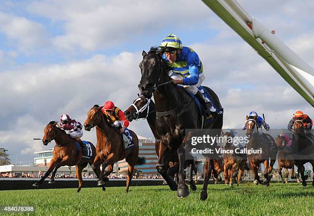 Damien Oliver riding Petits Filous defeats Chad Schofield riding Jalan Jalan in Race 6, the Lister Quezette Stakes during Melbourne racing at...