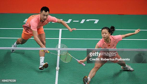 Xu Chen and Ma Jin of China compete against Liu Cheng and Bao Yixin of China in the semi final match of the 2015 Total BWF World Championship at...