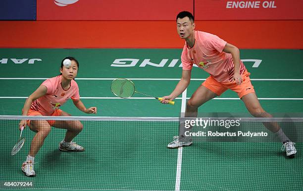 Xu Chen and Ma Jin of China compete against Liu Cheng and Bao Yixin of China in the semi final match of the 2015 Total BWF World Championship at...