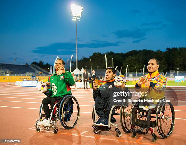 Iannotta Gianfranco wins Gold Medal in the Men's 200m T52 Final during the Parapan Am Games in Toronto Canada. To his right, Salvador Hernandez from...