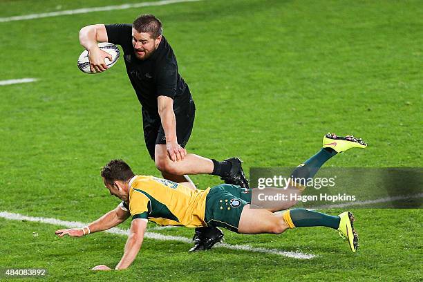 Dane Coles of the All Blacks beats the tackle of Nic White of the Wallabies to score a try during The Rugby Championship, Bledisloe Cup match between...