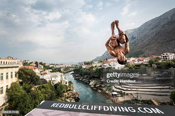 In this handout image provided by Red Bull, Sergio Guzman of Mexico dives from the 28 metre platform on the Stari Most bridge during the second...