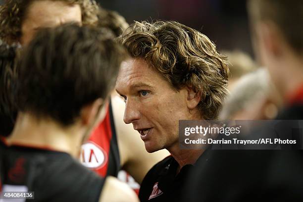 Essendon coach James Hird speaks with his players during the round 20 AFL match between the Essendon Bombers and the Adelaide Crows at Etihad Stadium...