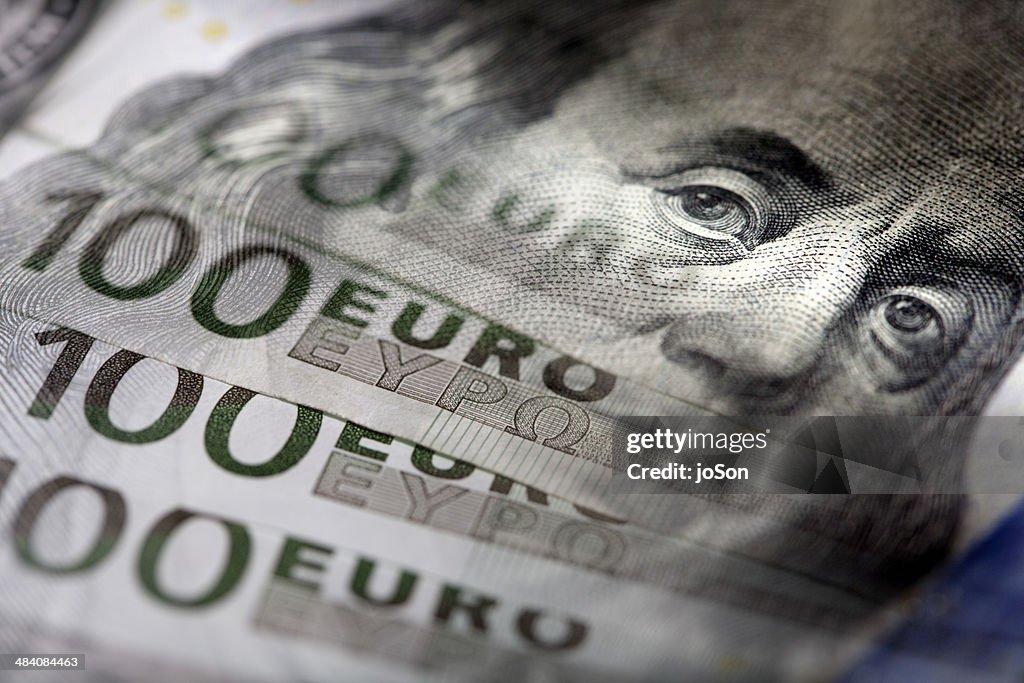 Detail of USD and Euros banknotes