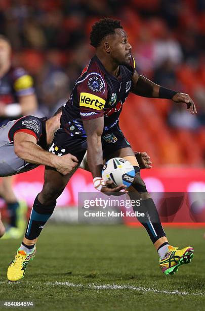 James Segeyaro of the Panthers passes as he is tackled during the round 23 NRL match between the Penrith Panthers and the New Zealand Warriors at...