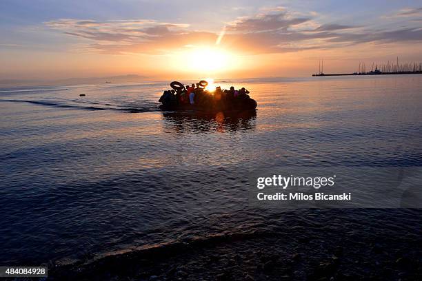 Dinghy with Syrian refugees arrives at a beach on the Greek island of Kos after crossing a part of the Aegean sea from Turkey to Greece on August 15,...