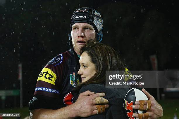 Nigel Plum of the Panthers celebrates with his family after playing his 150th NRL match during the round 23 NRL match between the Penrith Panthers...