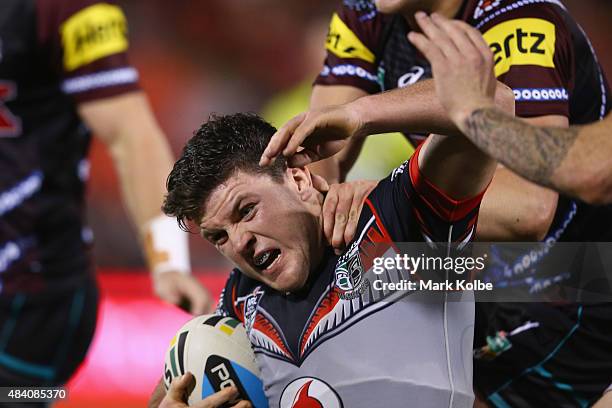 Chad Townsend of the Warriors is tackled during the round 23 NRL match between the Penrith Panthers and the New Zealand Warriors at Pepper Stadium on...