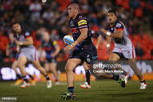 Lelani Latu of the Panthers makes a break during the round 23 NRL match between the Penrith Panthers and the New Zealand Warriors at Pepper Stadium...