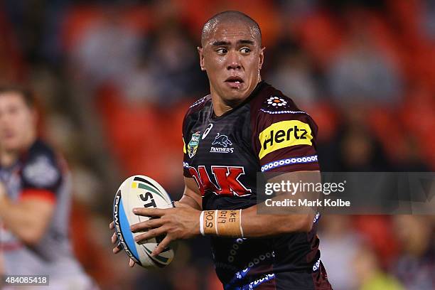 Lelani Latu of the Panthers looks for support as he makes a break during the round 23 NRL match between the Penrith Panthers and the New Zealand...