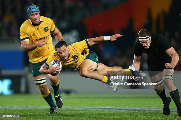 Matt Toomua of the Wallabies breaks through the defence during The Rugby Championship, Bledisloe Cup match between the New Zealand All Blacks and the...