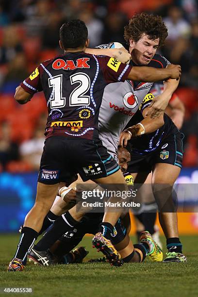 Tyrone Peachey of the Panthers tackles Charlie Gubb of the Warriors during the round 23 NRL match between the Penrith Panthers and the New Zealand...