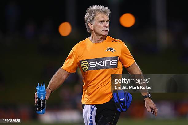 Head trainer of the Penrith Panthers Ronnie Palmer watches on as he runs water during the round 23 NRL match between the Penrith Panthers and the New...