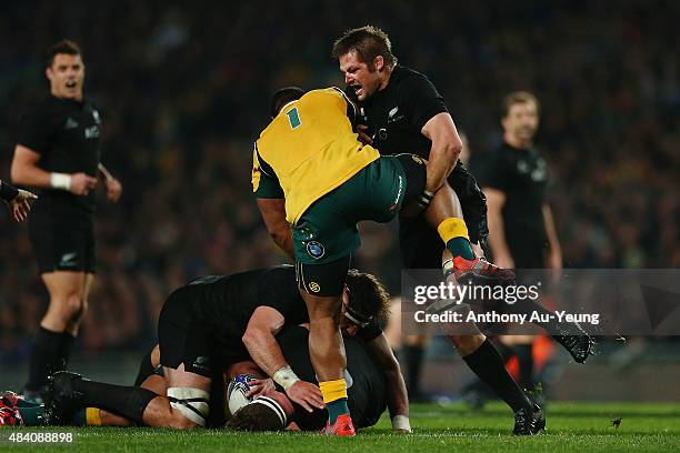 Richie McCaw of New Zealand cleans up the ruck against Scott Sio of Australia during The Rugby Championship, Bledisloe Cup match between the New...