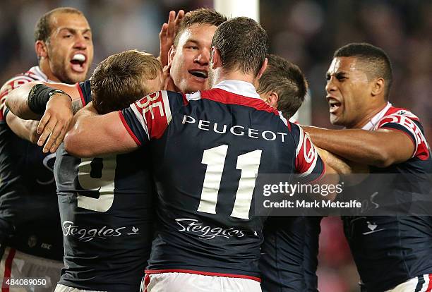 Jared Waerea-Hargreaves of the Roosters celebrates scoring a try with team mates during the round 23 NRL match between the Sydney Roosters and the...