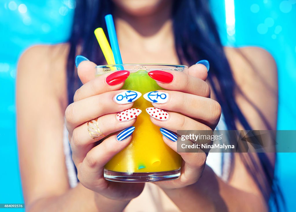 Young woman with marine sailor manicure