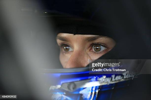 Danica Patrick, driver of the GoDaddy Chevrolet, sits in her car during practice for the NASCAR Sprint Cup Series Pure Michigan 400 at Michigan...