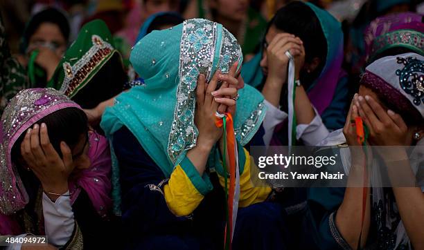 Kashmir school students in traditional Kashmiri attire hide their faces from being photographed, annually Kashmir students from government run...