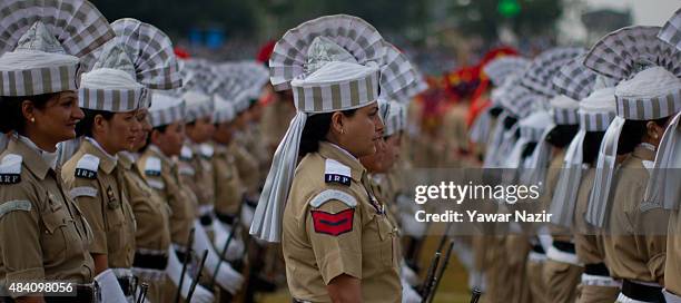 Indian police women stand in formation before their parade at Bakshi Stadium, where the authorities hold the main function, during India's...