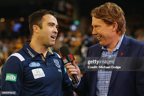 Cats head coach Chris Scott is interviewed by Cameron Ling during the round 20 AFL match between the Geelong Cats and the Hawthorn Hawks at Melbourne...