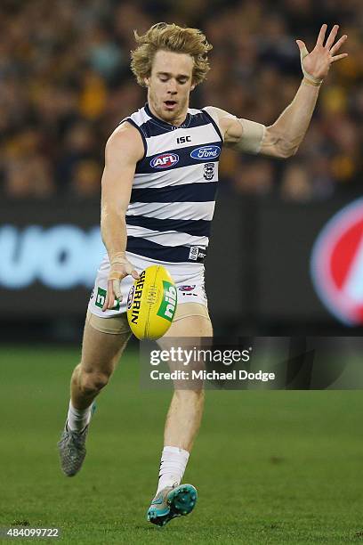 Cameron Guthrie of the Cats kicks the ball during the round 20 AFL match between the Geelong Cats and the Hawthorn Hawks at Melbourne Cricket Ground...