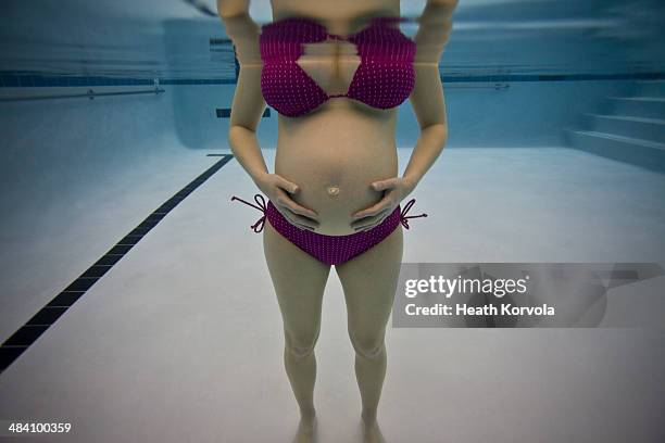 pregnant woman in bikini in indoor swimming pool. - whitefish foto e immagini stock