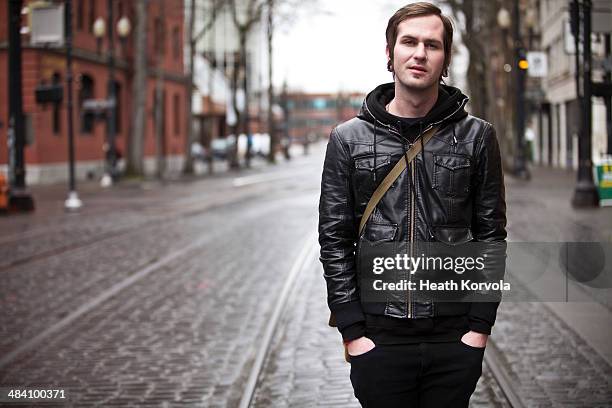 portrait of urban twenty something man downtown. - portland oregon downtown stock pictures, royalty-free photos & images