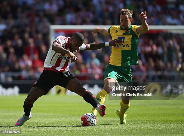 Jeremain Lens of Sunderland and Steven Whittaker of Norwich City compete for the ball during the Barclays Premier League match between Sunderland and...