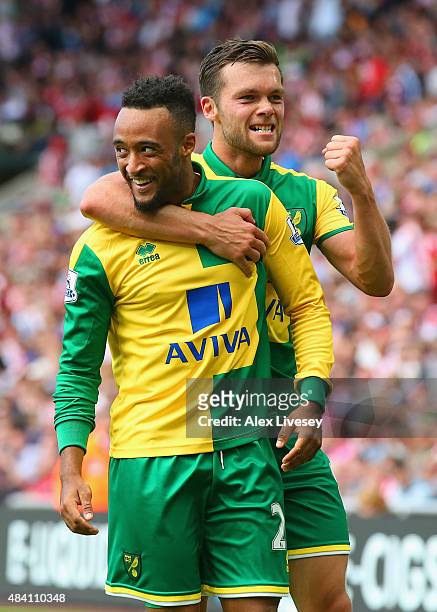 Nathan Redmond of Norwich City celeberates scoring his team's third goal with his team mates Jonathan Howson during the Barclays Premier League match...