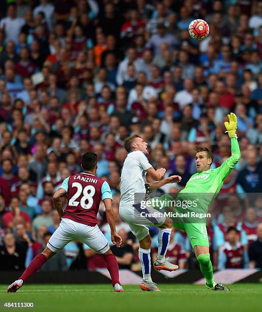 Adrian of West Ham United tackles Jamie Vardy of Leicester City resulting in the red card during the Barclays Premier League match between West Ham...