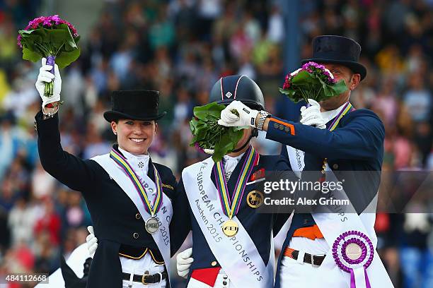 Charlotte Dujardin of Great Britain celebrates winning the Dressage Grand Prix Special Individual Final with second placed Kristina Broering-Sprehe...