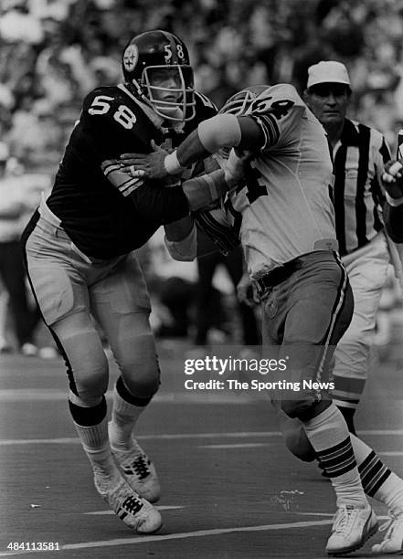 Jack Lambert of the Pittsburgh Steelers is blocked circa 1970s.