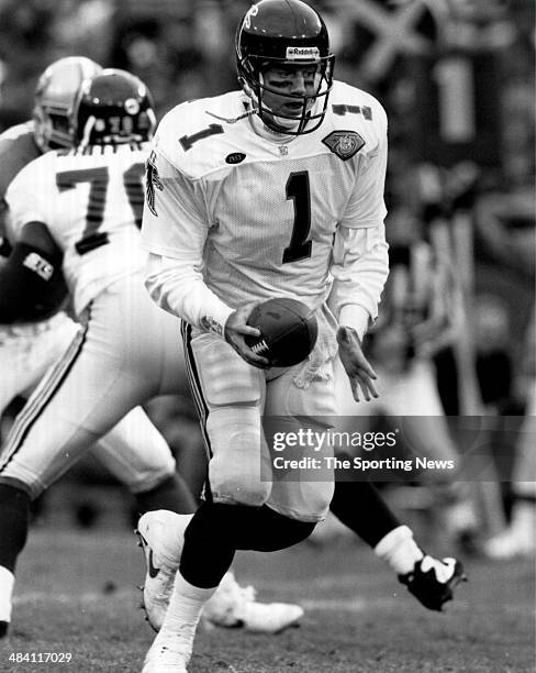 Jeff George of the Atlants Falcons looks to hand off circa 1990s.