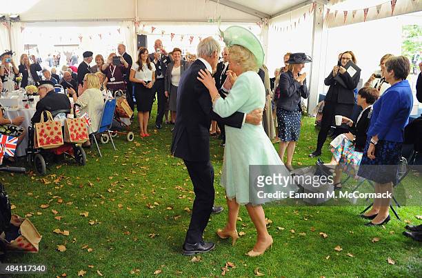 Camilla, Duchess of Cornwall dances with Royal Navy Veteran Jim Booth aged 94 from Taunton, Somerset during the 70th Anniversary commemorations of VJ...